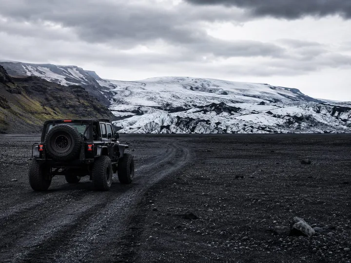 Super jeep crossing the glacier with guides